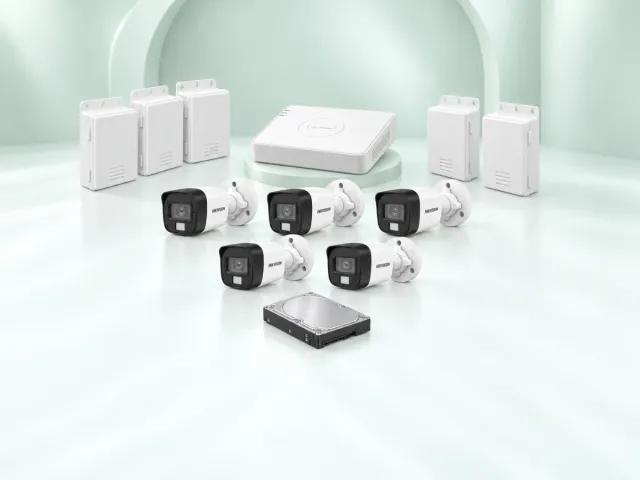 5 Hikvision DS-2CE16D0T-EXLPF cameras, DS-7108HGHI-M1/T DVR, 500GB HDD and 5 power supplies on a light mint studio background